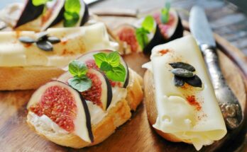 Healthy high-calorie foods like avocado, eggs, salmon, and nuts arranged on a plate for natural weight gain