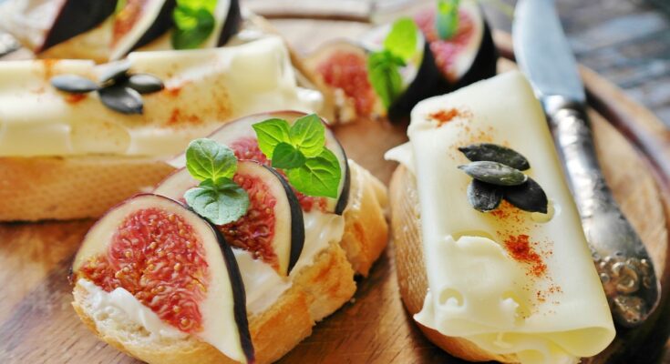 Healthy high-calorie foods like avocado, eggs, salmon, and nuts arranged on a plate for natural weight gain