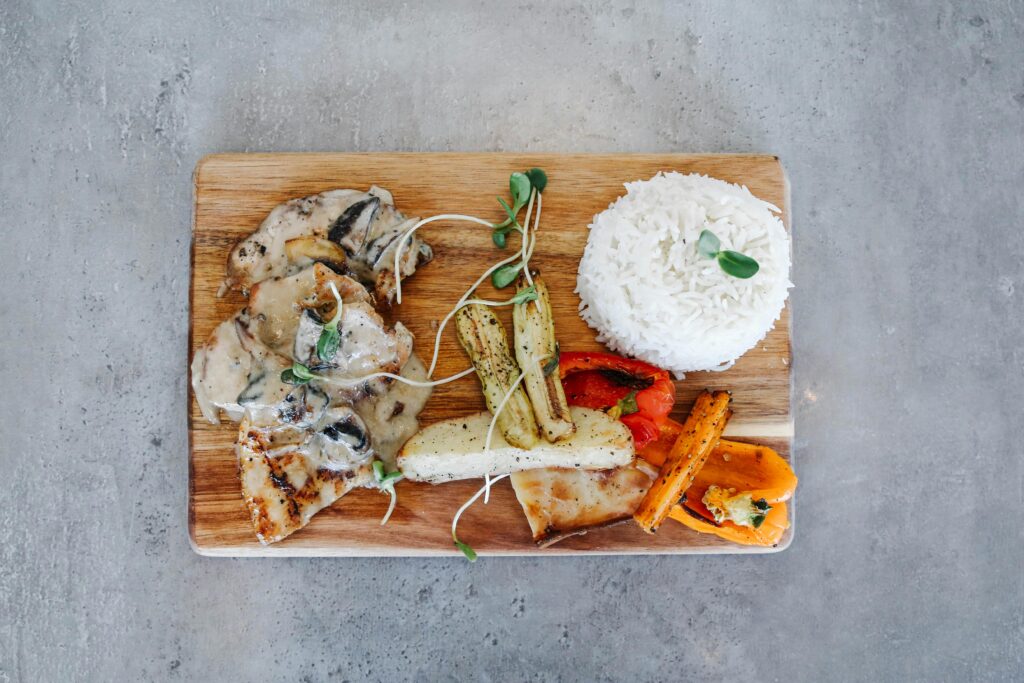 A well-balanced meal (grilled chicken, brown rice, vegetables)